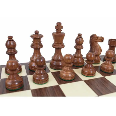 Classic VII pieces in golden rosewood: king, queen, bishop and pawns on the board