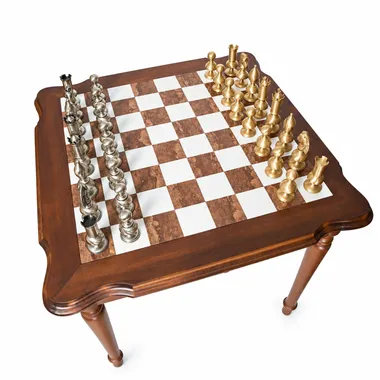 Overhead view of the Tuscan alabaster chessboard with gold and silver pieces