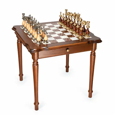 Wooden games table with alabaster chessboard and solid brass pieces