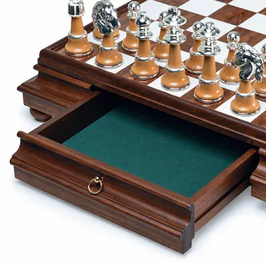 Open storage drawer lined with green felt beneath the alabaster chess board