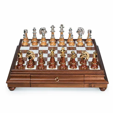 Staunton XL III chess set viewed at an angle with gold and silver pieces