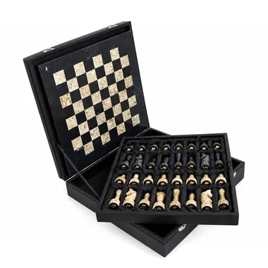 Open storage box with marble chess board and pieces stored inside