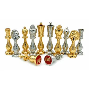 Close-up of engraved Staunton kings and queens in gold and silver plated metal