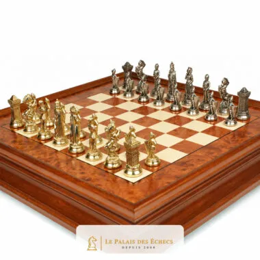 Gold and silver metal chess pieces on briar wood chess board