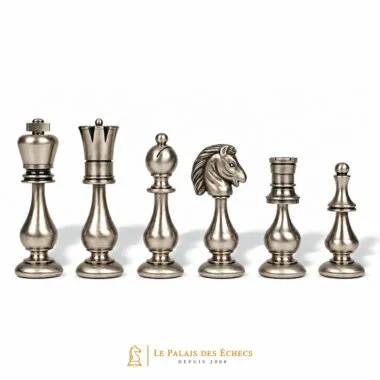 Silver-toned solid brass pieces: king, pawn, knight and rook from the Grand Oriental set