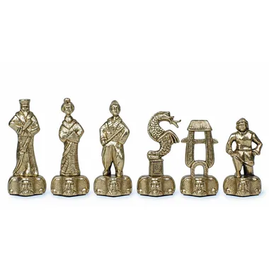 Samurai chess pieces in gold-toned metal, close-up of king, dragon and rook