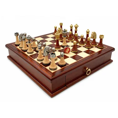 Classic XV chess pieces in gold and silver metal on wooden chess board