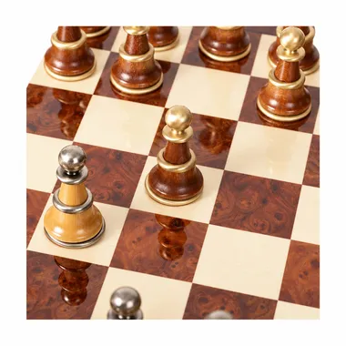 Close-up of lacquered briar squares and wooden pawns on the board