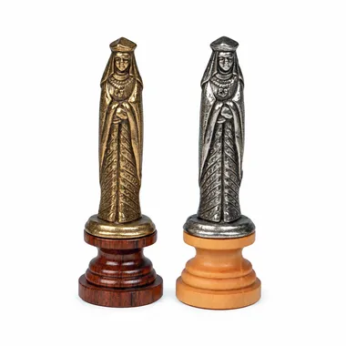 Queen pieces from the medieval chess set, gold and silver versions side by side