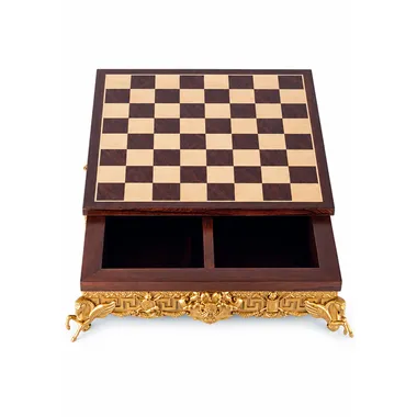 Chess board open revealing the internal storage compartment