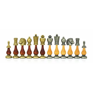 Chess pieces in metal and solid wood lined up, kings and queens visible