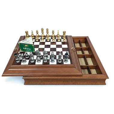 Top view of the open box with gold and silver brass pieces