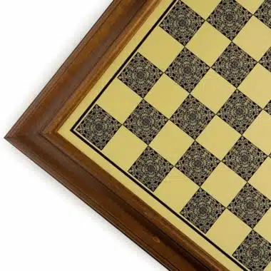 Wood and brass-effect chess board, detail of the corner and engraved squares
