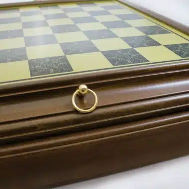 Wood and brass-effect chess board, detail of the box's golden handle