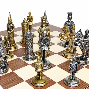 Camelot King Arthur I chess pieces arranged on the rosewood chess board