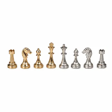 Chess pieces in gold and silver plated metal, aligned overview