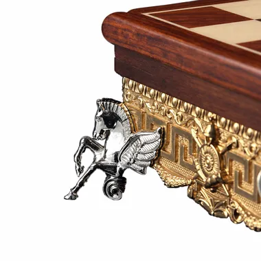 Detail of a silver-toned metal foot shaped like a winged horse