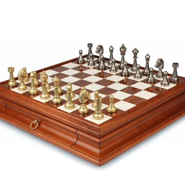 Marble chess board with gold and silver-tone metal pieces in opening position
