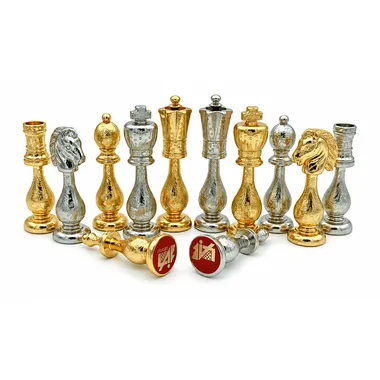 Gold and silver metal pieces with engraved bases and red detail