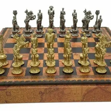 Solid metal gold and silver pieces arranged on the Napoleon chess board