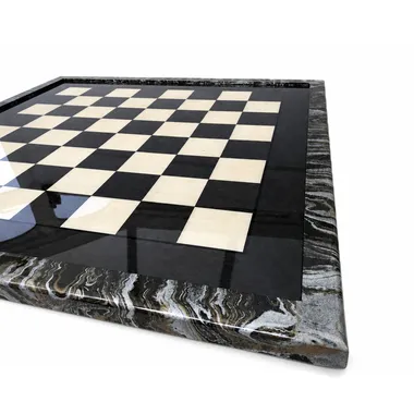 Chessboard in grey briar wood, close-up of corner and glossy surface