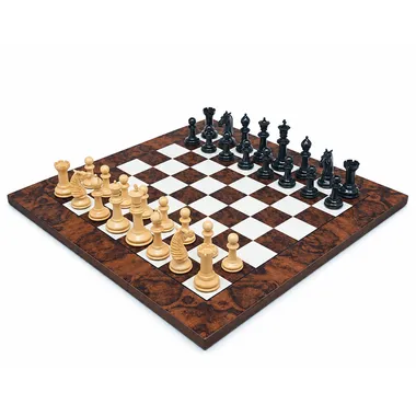 Complete chess set arranged on the dark walnut chess board, overall view