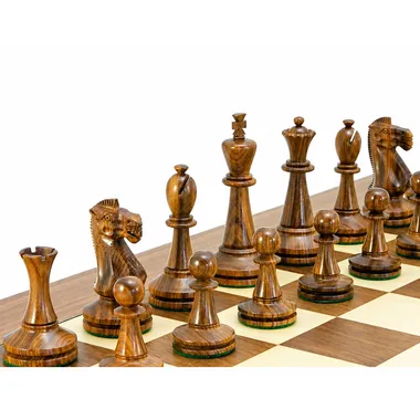 Close-up of dark Blackmore pieces, knight and king in golden rosewood