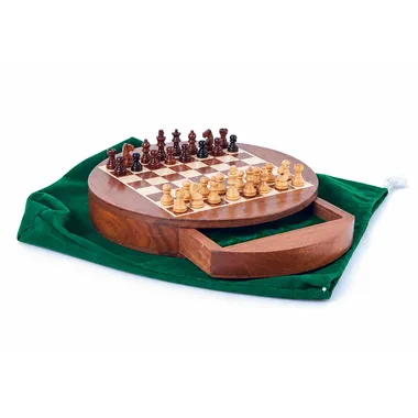 Round travel chess set placed on a green fabric pouch