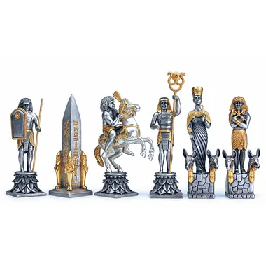 Gold and silver Egyptian pieces: obelisk, knight, pharaoh and queen