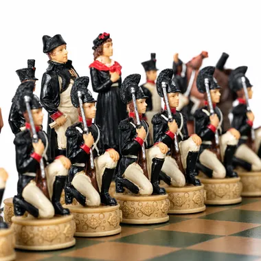 Napoleon chess pieces facing the black soldiers on the wooden chessboard