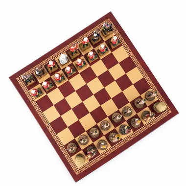 Red faux-leather chess board with Anglo-Zulu War chess pieces, diagonal view