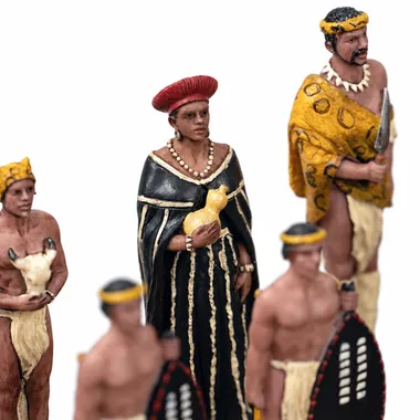 Resin chess pieces, Zulu figures in traditional headdress and attire