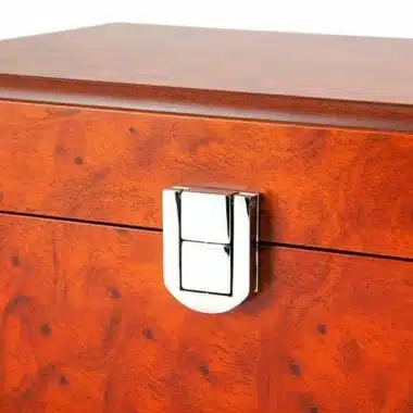 Detail of the chrome clasp and burr wood veneer on the box lid