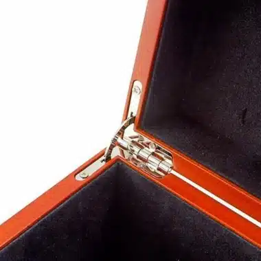 Detail of the chrome metal hinge at the inner corner of the storage box
