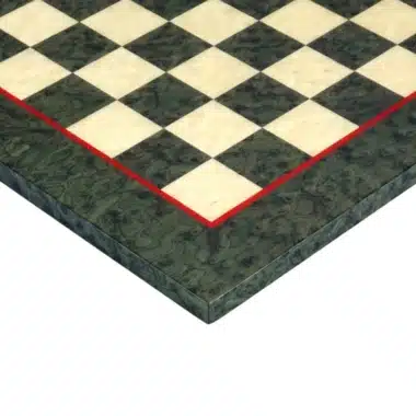 Chess board in green maple wood, close-up of the corner and red border