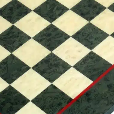 Chess board in green maple wood, close-up of squares diagonally