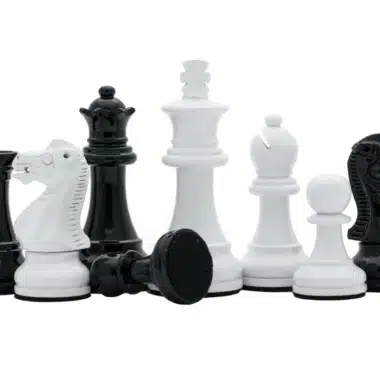 Staunton chess pieces lacquered with knights, queen and visible felt base