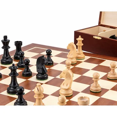 Boxwood and ebonised boxwood pieces mid-game, birch storage box in the background