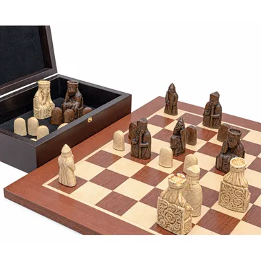 Open storage box showing Isle of Lewis pieces stored beside the board