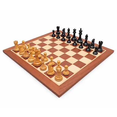 Complete Abbaye chess set, boxwood and ebonised boxwood pieces on mahogany and maple board