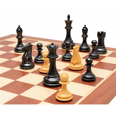 Close-up of black Abbaye pieces, king, queens and knights facing white pawns