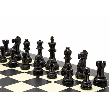 Dark boxwood pieces lined up closely on the maple chess board