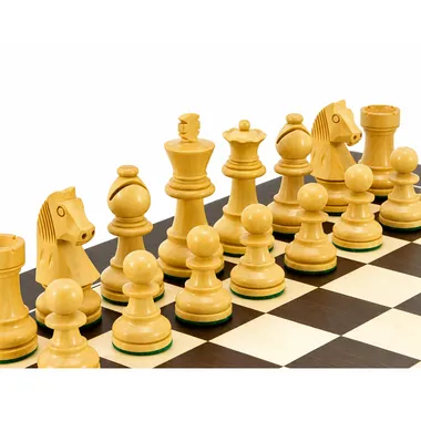 Light boxwood pieces seen up close, detail of knights and pawns on the board