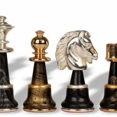 Pieces lined up, king, rook, knight and pawn in solid brass
