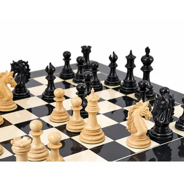 Close-up of light pieces and carved knight on the lacquered chess board