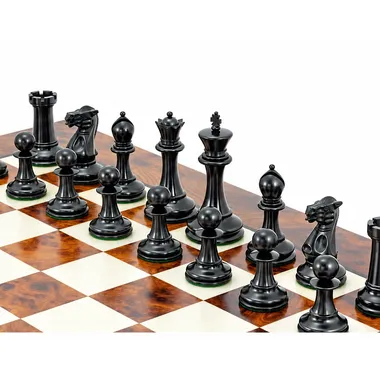 Black ebony wood chess pieces shown close up on the lacquered board