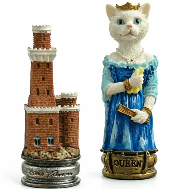 Cat chess pieces, the crowned white queen beside a castle rook