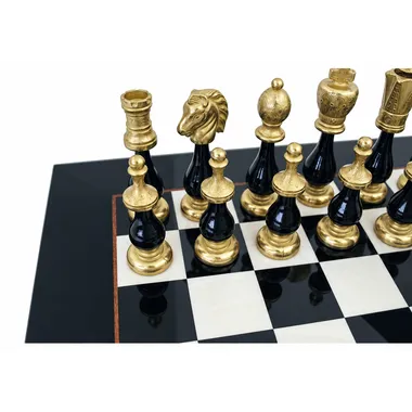 Close-up of the gold and black pieces near a board corner
