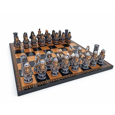 Complete skull chess set on black and gold faux leather chessboard