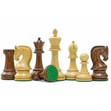 Acacia wood chess pieces grouped together, green felt base visible